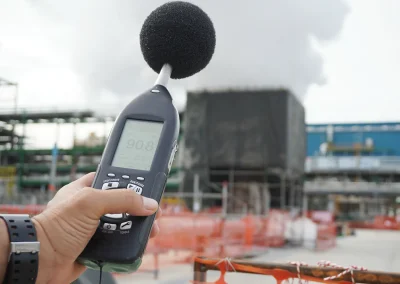 Environmental officer holding to use sound level meter for monitor